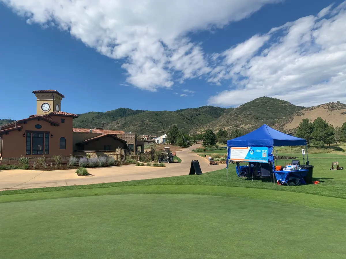 Colorado foothills rising behind a golf clubhouse near Denver
